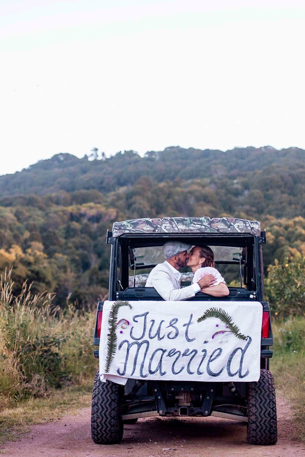 ust_married_sign_utv_buggy_getaway_kiss_countryside_de5580c3c0