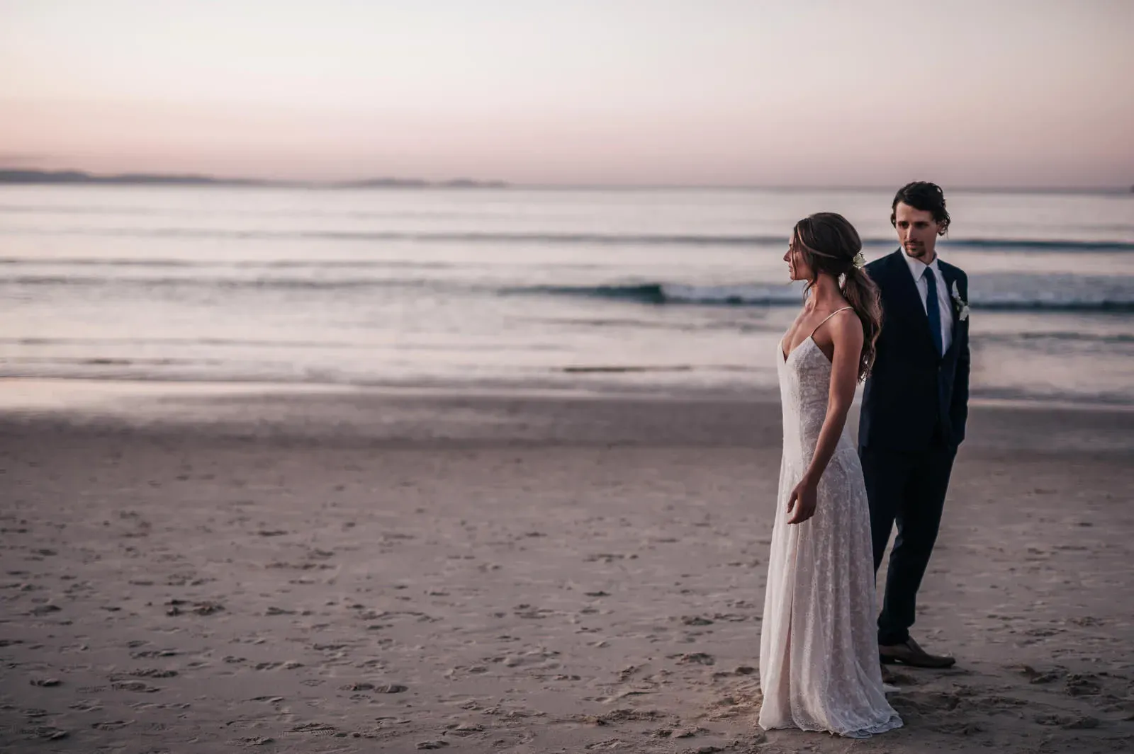Bride and groom on the beach at sunset in Byron Bay