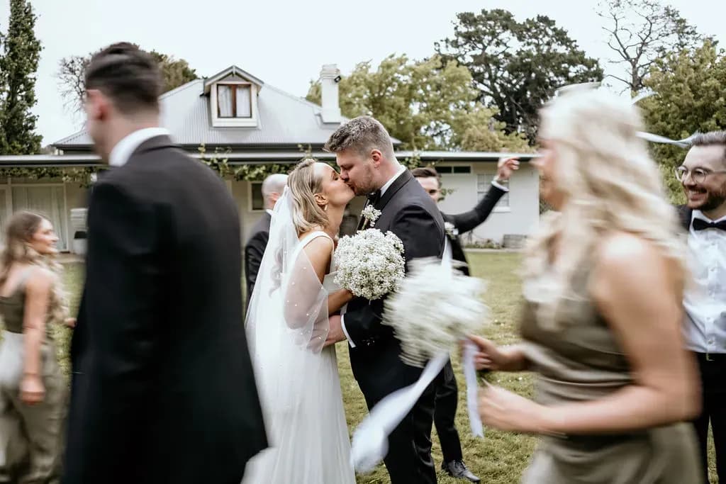 alison_and_brock_wedding_kiss_outdoor_ceremony_4a9b99a5fe