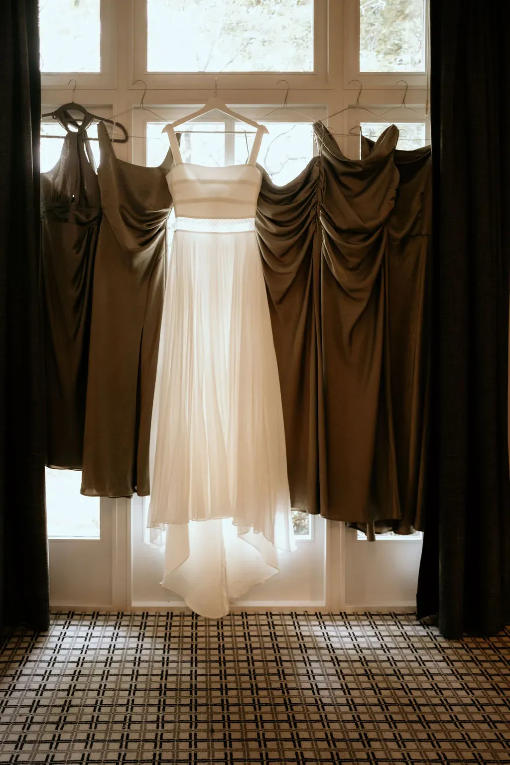 alison_wedding_dress_and_bridesmaid_dresses_hanging_1bbc297f1c