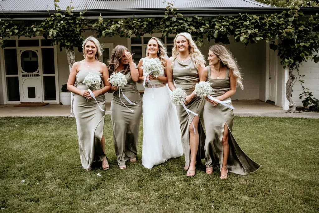 smiling_bridesmaids_walking_with_alison_wedding_day_541e5fe04f